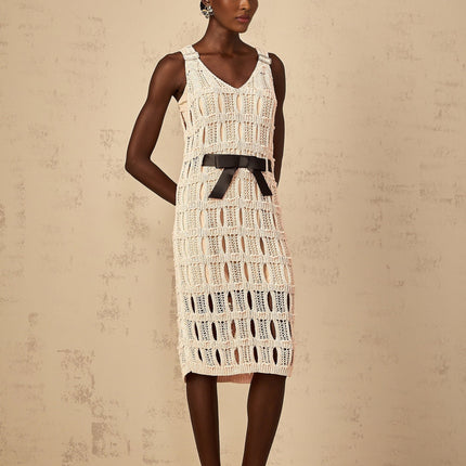 A pink midi dress with a crochet knit pattern featuring a decorative bowknot detail