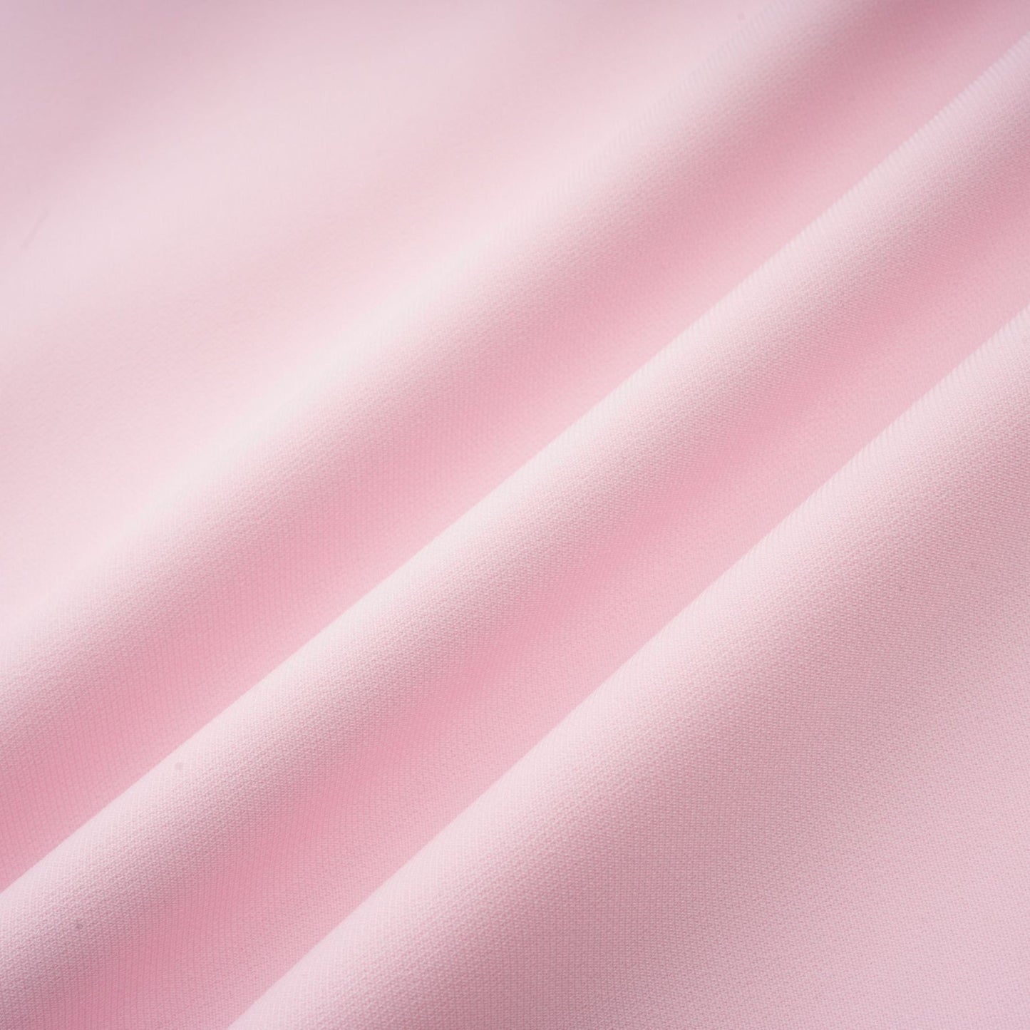 A pink midi dress with a crystalaccented bow and a silhouette inspired by the Cassiopeia constellation