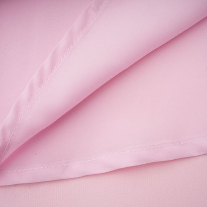 A pink midi dress with a crystalaccented bow design inspired by the Cassiopeia constellation featuring a feminine silhouette and elegant details
