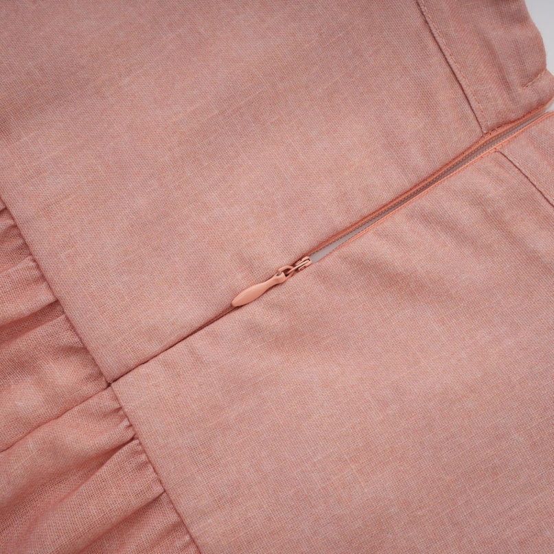 A pink midi dress with a floral print pattern and Vneck design called Sidonie