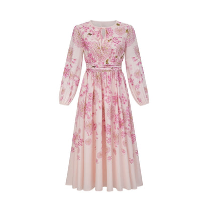 A pink midi dress with a floral print pattern covering the fabric named Yvette