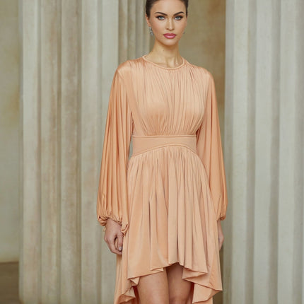 A pink midi dress with asymmetrical design and pleated details featuring a sleeveless style and flowy silhouette