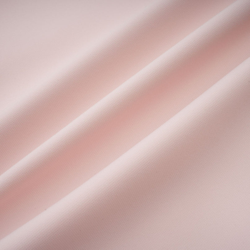 A pink midi dress with crystal embellishments and colorblocked design featuring the name Anais