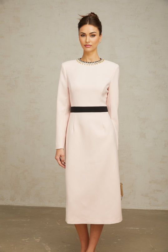 A pink midi dress with crystal embellishments and colorblocked design featuring the name Anais