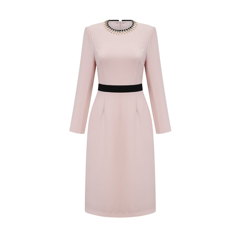A pink midi dress with crystal embellishments and colorblocked design featuring the name Anais