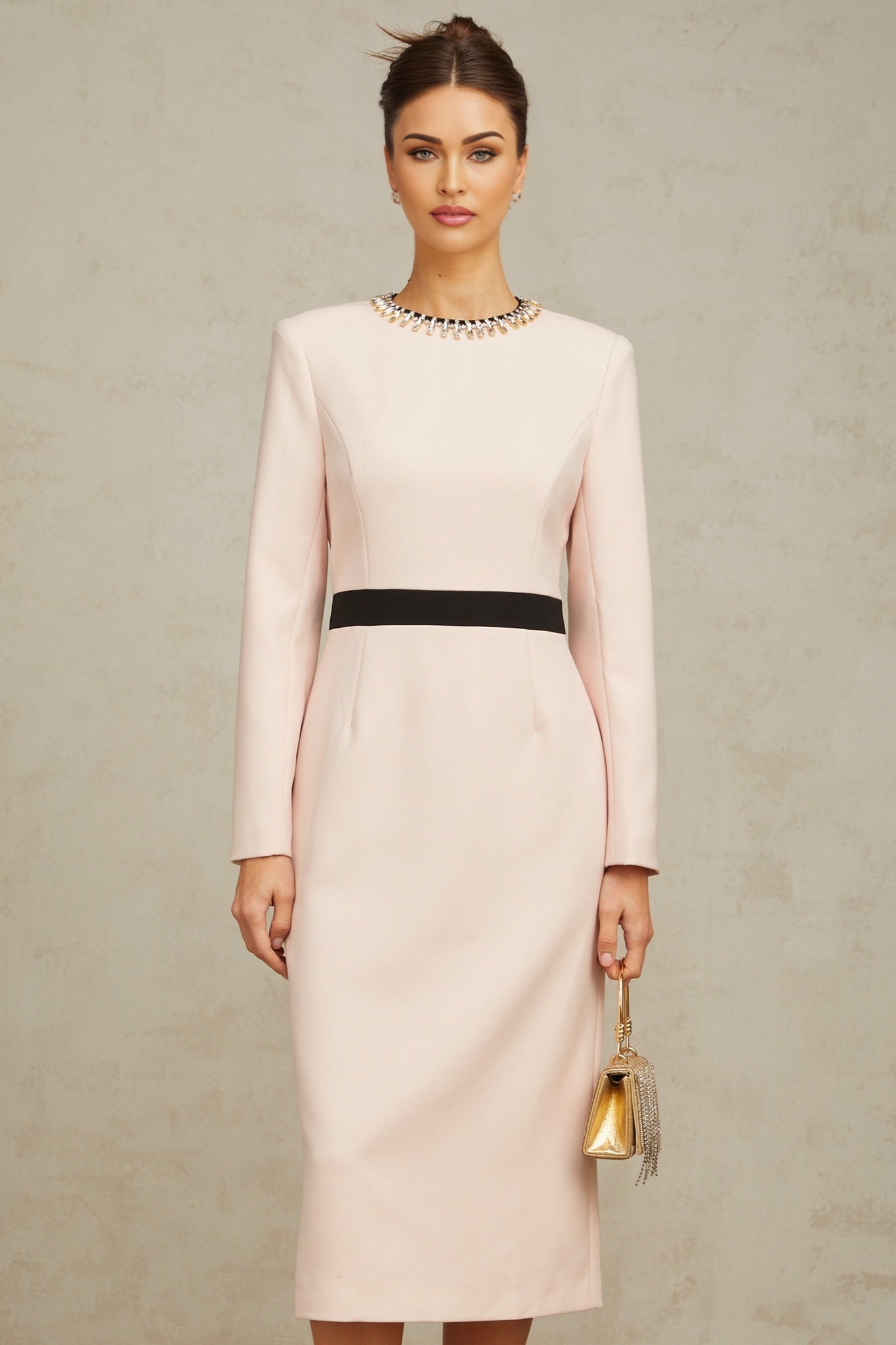 A pink midi dress with crystal embellishments and colorblocked design featuring the name Anais