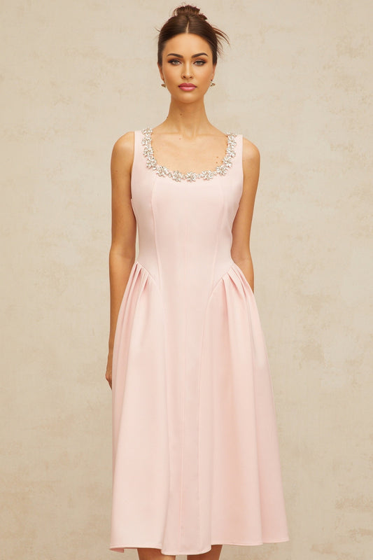 A pink midi dress with crystal embellishments and pleated details named Beatrice