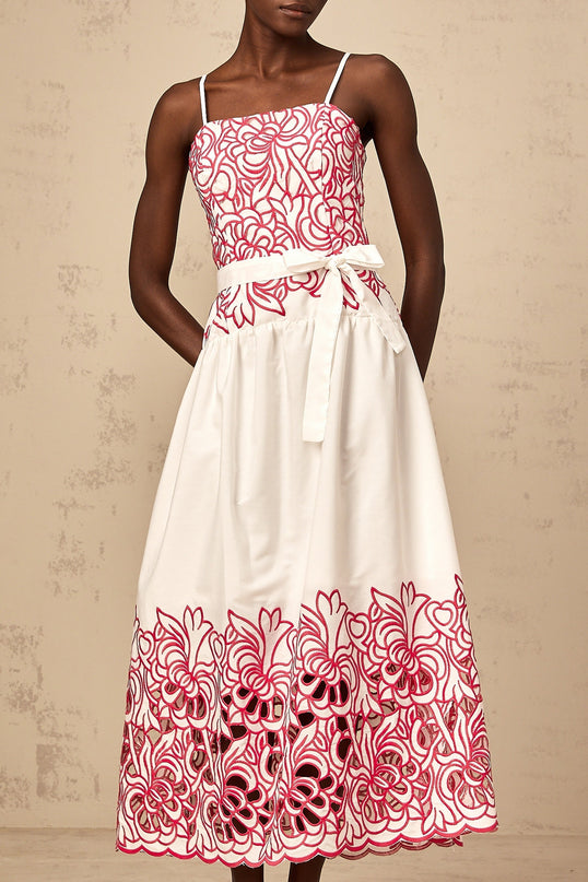 A pink midi dress with cut out details and embroidery named Beatrice