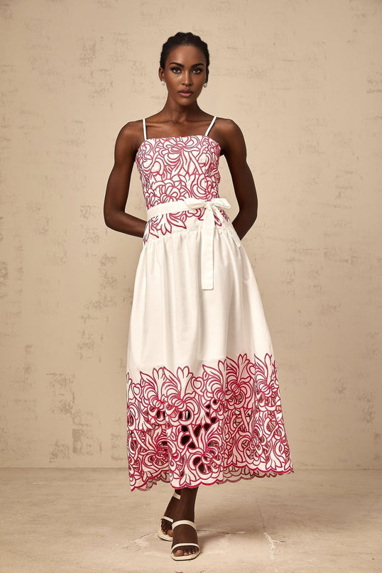 A pink midi dress with embroidery and cut out details named Beatrice