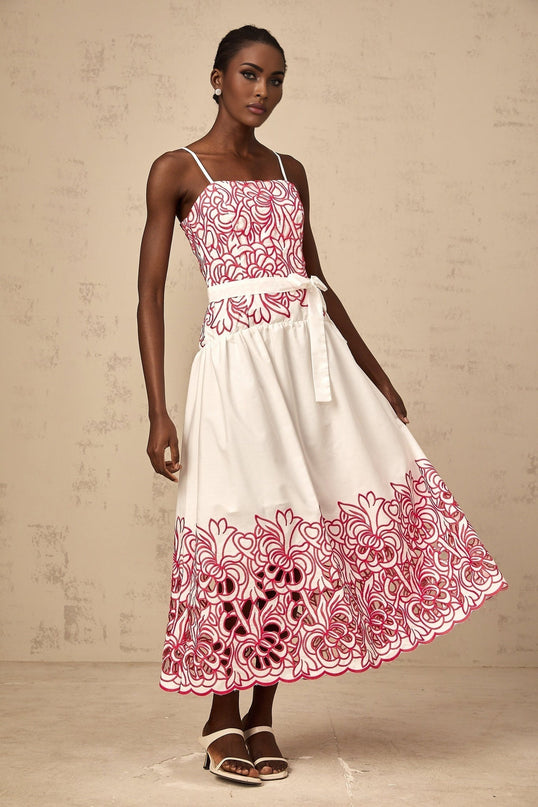 A pink midi dress with embroidery and cut out details named Beatrice