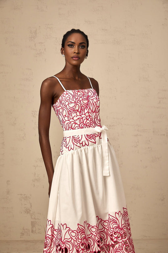 A pink midi dress with embroidery details and cut out sections named Beatrice