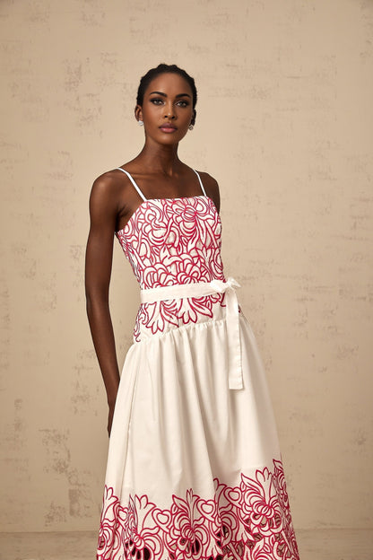 A pink midi dress with embroidery details and cut out sections named Beatrice