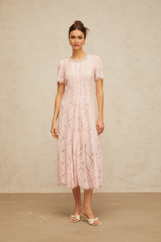 A pink midi dress with floral lace pattern and embellishments called Dulcie