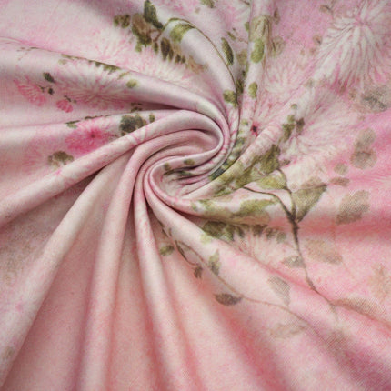 A pink midi dress with floral print and embellishments featuring a feminine Narcisse design