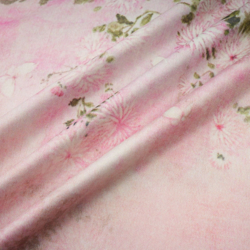 A pink midi dress with floral print and embellishments featuring a Narcisse design