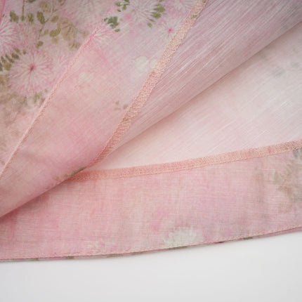 A pink midi dress with floral print and embellishments featuring a Narcisse design