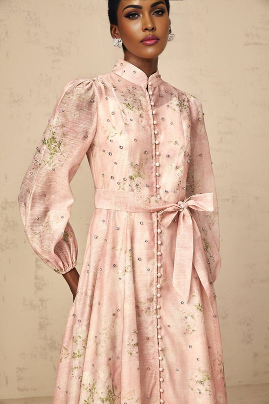 A pink midi dress with floral print and embellishments featuring a Narcisse design