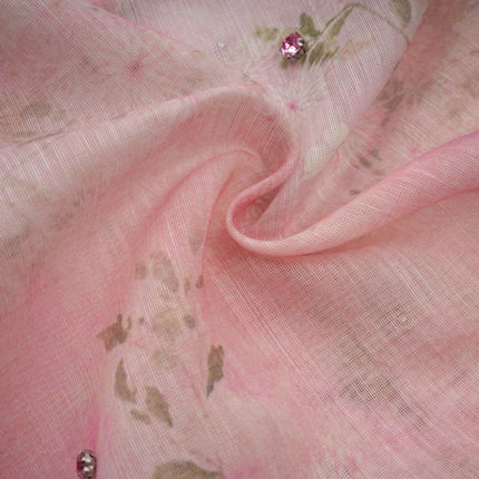 A pink midi dress with floral print and embellishments featuring a Narcisse design