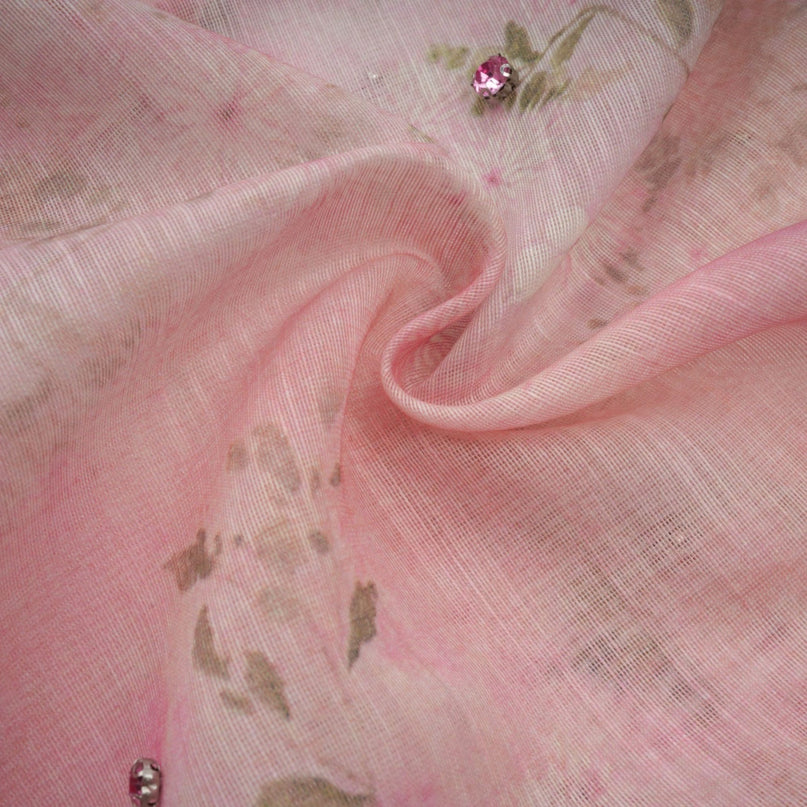 A pink midi dress with floral print and embellishments featuring a Narcisse design