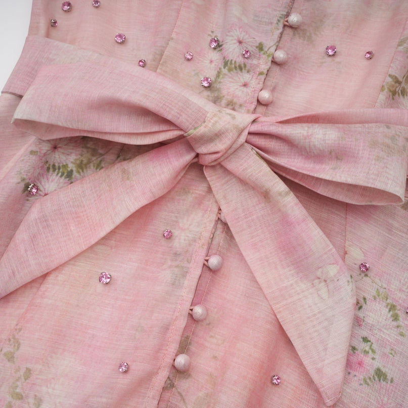 A pink midi dress with floral print pattern and embellishments named Narcisse