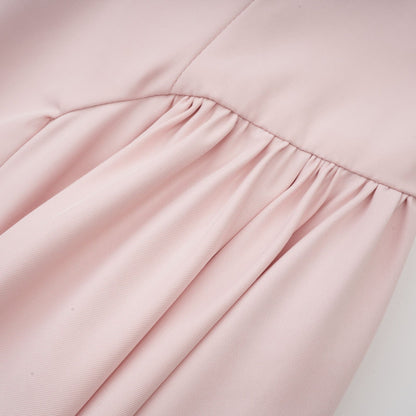 Pink sleeveless dress with delicate spaghetti straps bustier style top pleated design and flared skirt