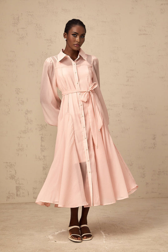 A pink midi length shirt dress with a tied waist detail named Sibylle