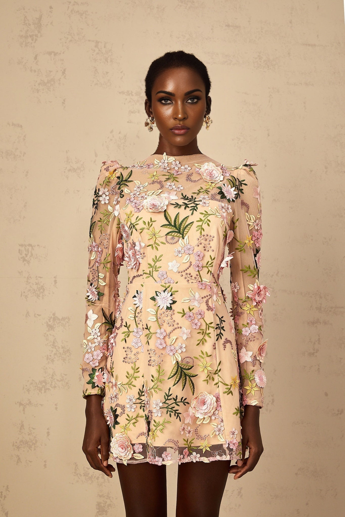 A pink mini dress with 3D floral applique details called Jolien