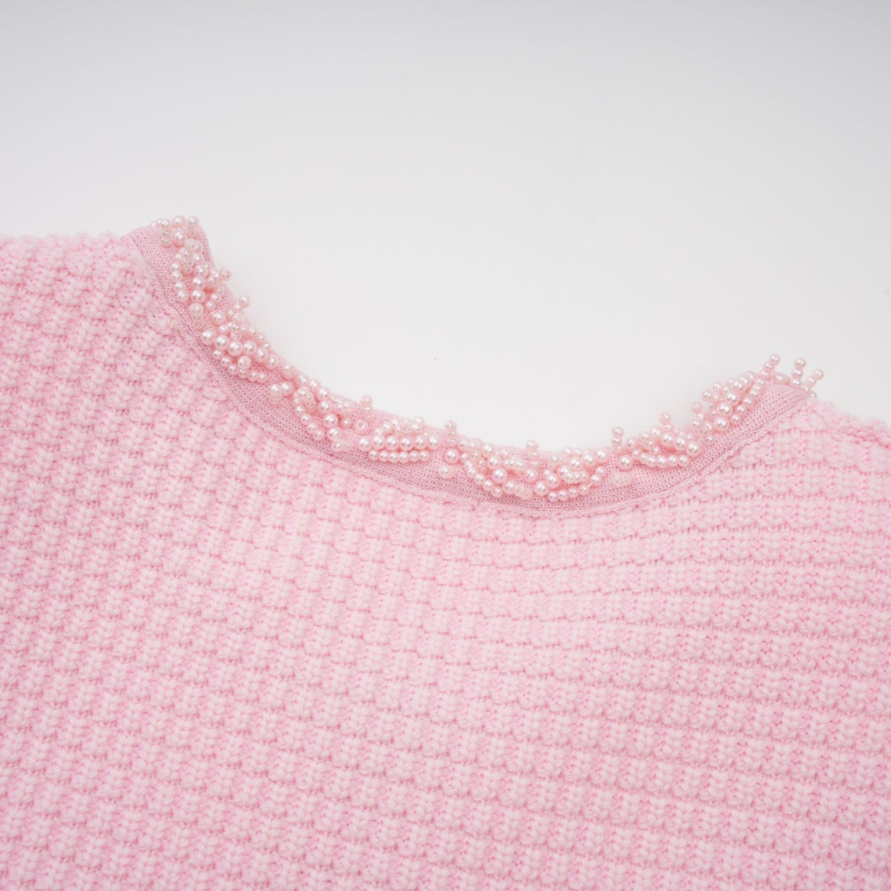 A pink mini dress with a knit texture and beaded embellishments named Eugenie