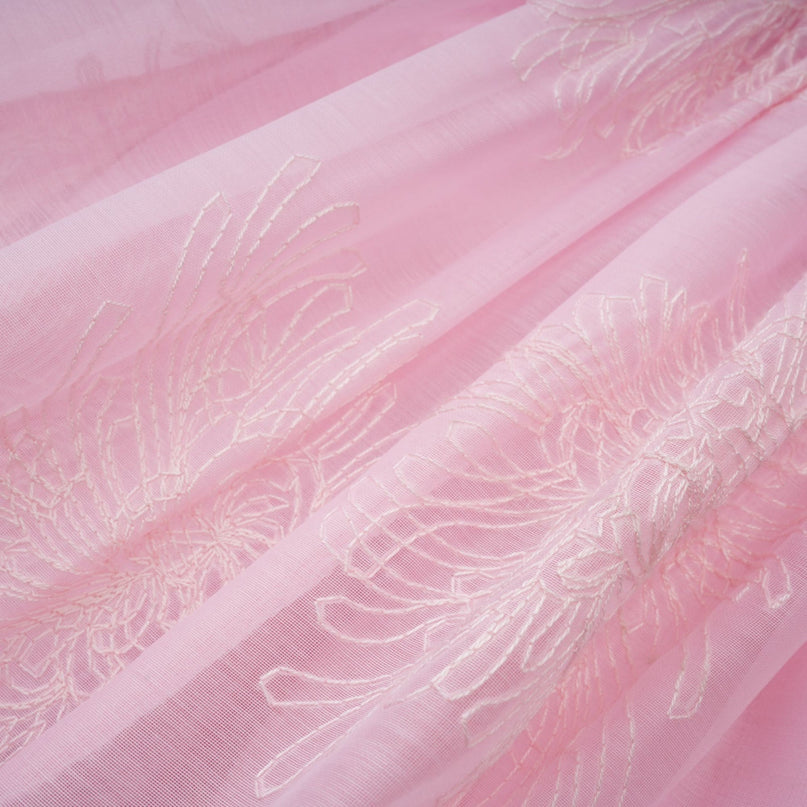 A pink mini dress with floral embroidery and layered design named Florence