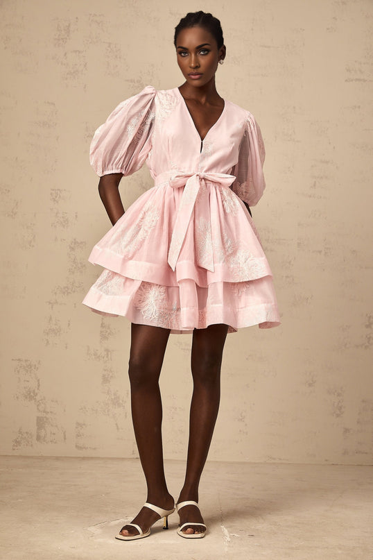A pink mini dress with floral embroidery and layered skirt design named Florence