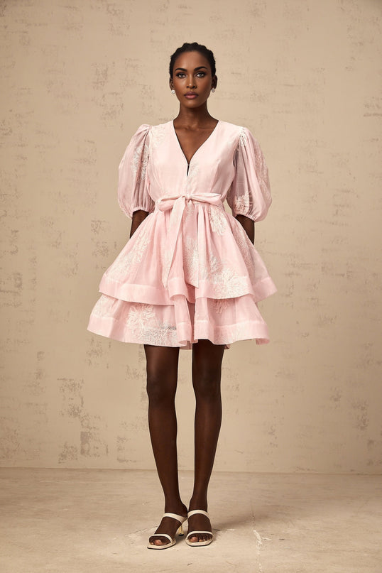 A pink mini dress with layered skirt and floral embroidery details named Florence