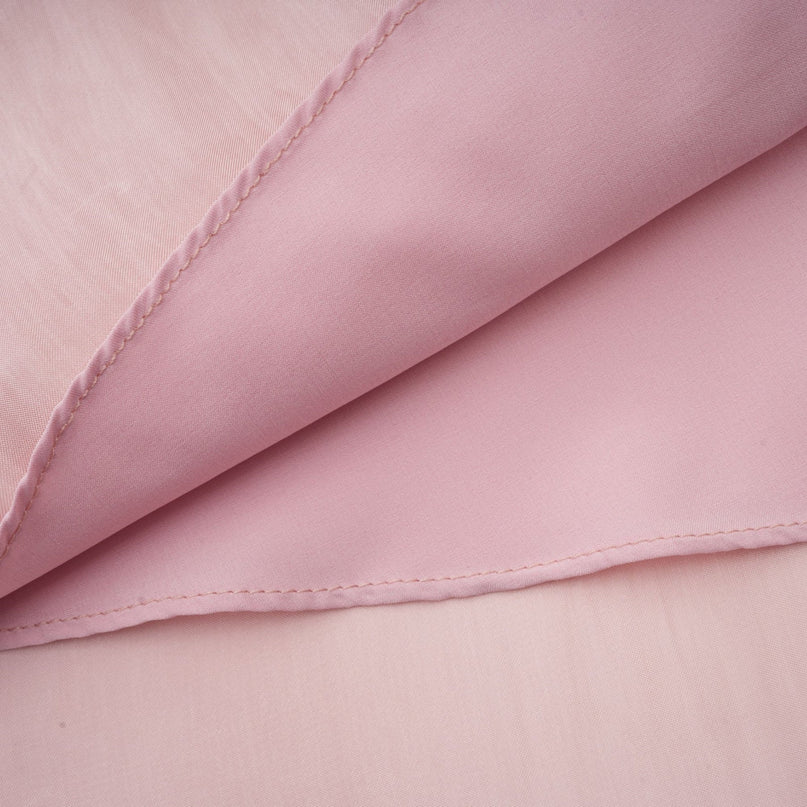 A pink mini dress with pleated skirt and embellished details named Helena