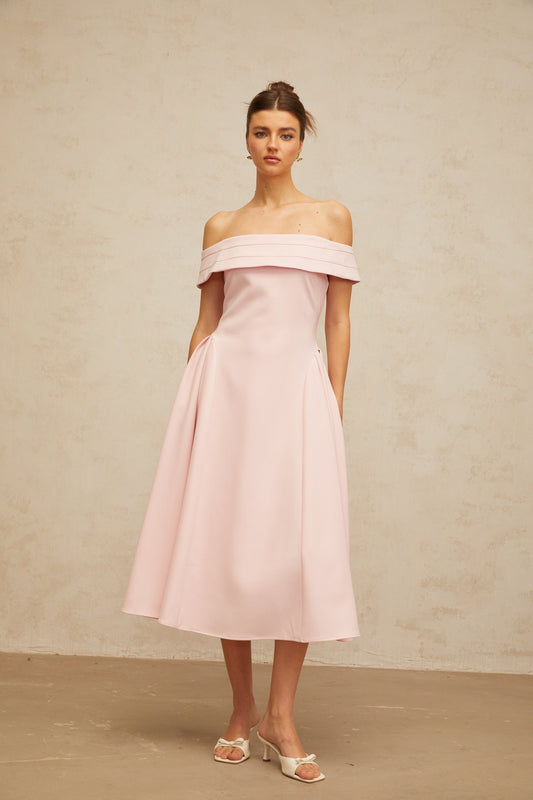 A pink off shoulder midi dress with pleated details and a fitted waist