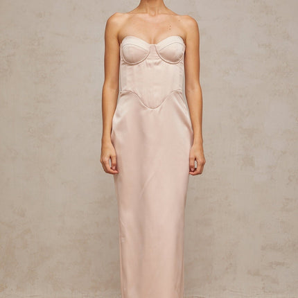 A pink offshoulder maxi dress with a corsetstyle bodice made of satin fabric featuring a long flowing skirt