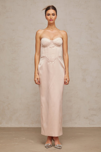 A pink offshoulder maxi dress with a corsetstyle bodice made of satin fabric featuring a long flowing skirt