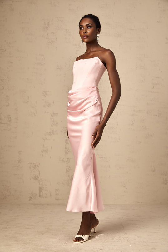 A pink offshoulder maxi dress with a flowing silhouette and long skirt named Aurore