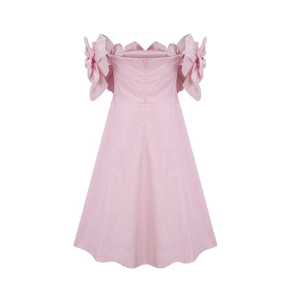 A pink offshoulder midi dress featuring 3D petal details named Juliette