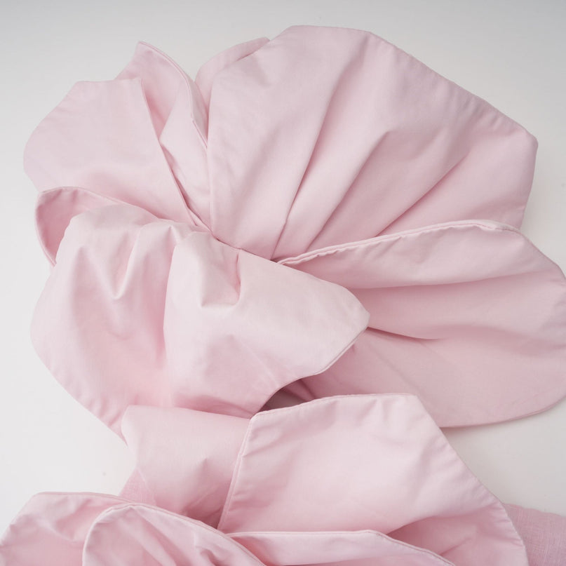 A pink offshoulder midi dress with 3D petal details named Juliette