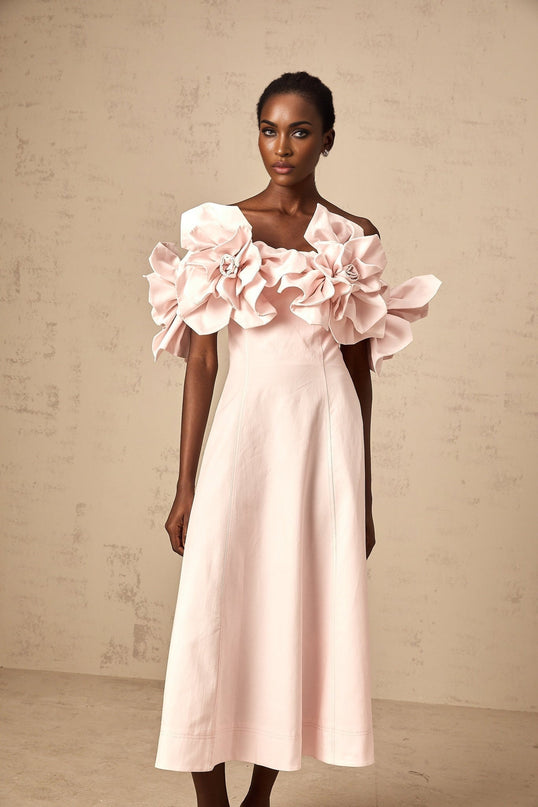 A pink offshoulder midi dress with 3D petal details named Juliette