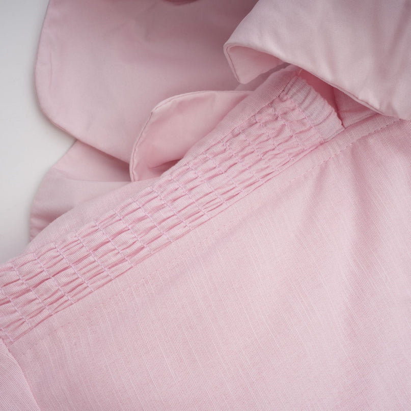 A pink offshoulder midi dress with 3D petal details named Juliette