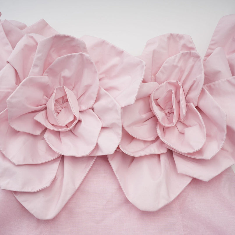 A pink offshoulder midi dress with 3D petal details named Juliette