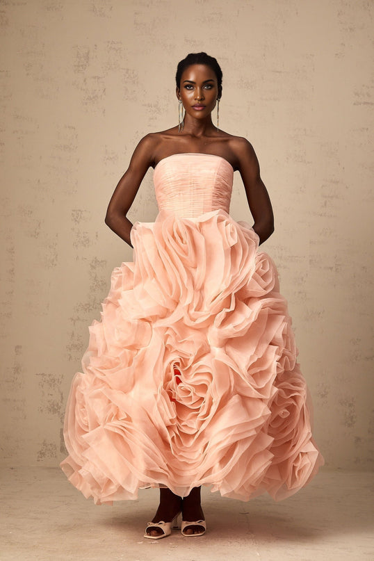 A pink offshoulder midi dress with 3D petal details on tulle fabric