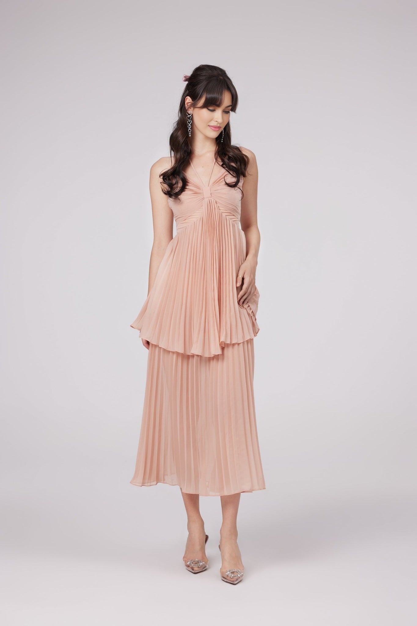A pink pleated tiered midi dress with a feminine silhouette named Olympe