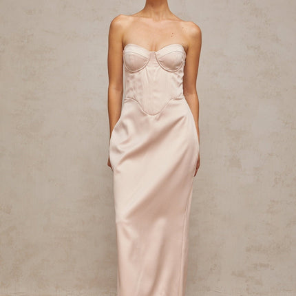 A pink satin maxi dress with an offshoulder corset style bodice named Elodie