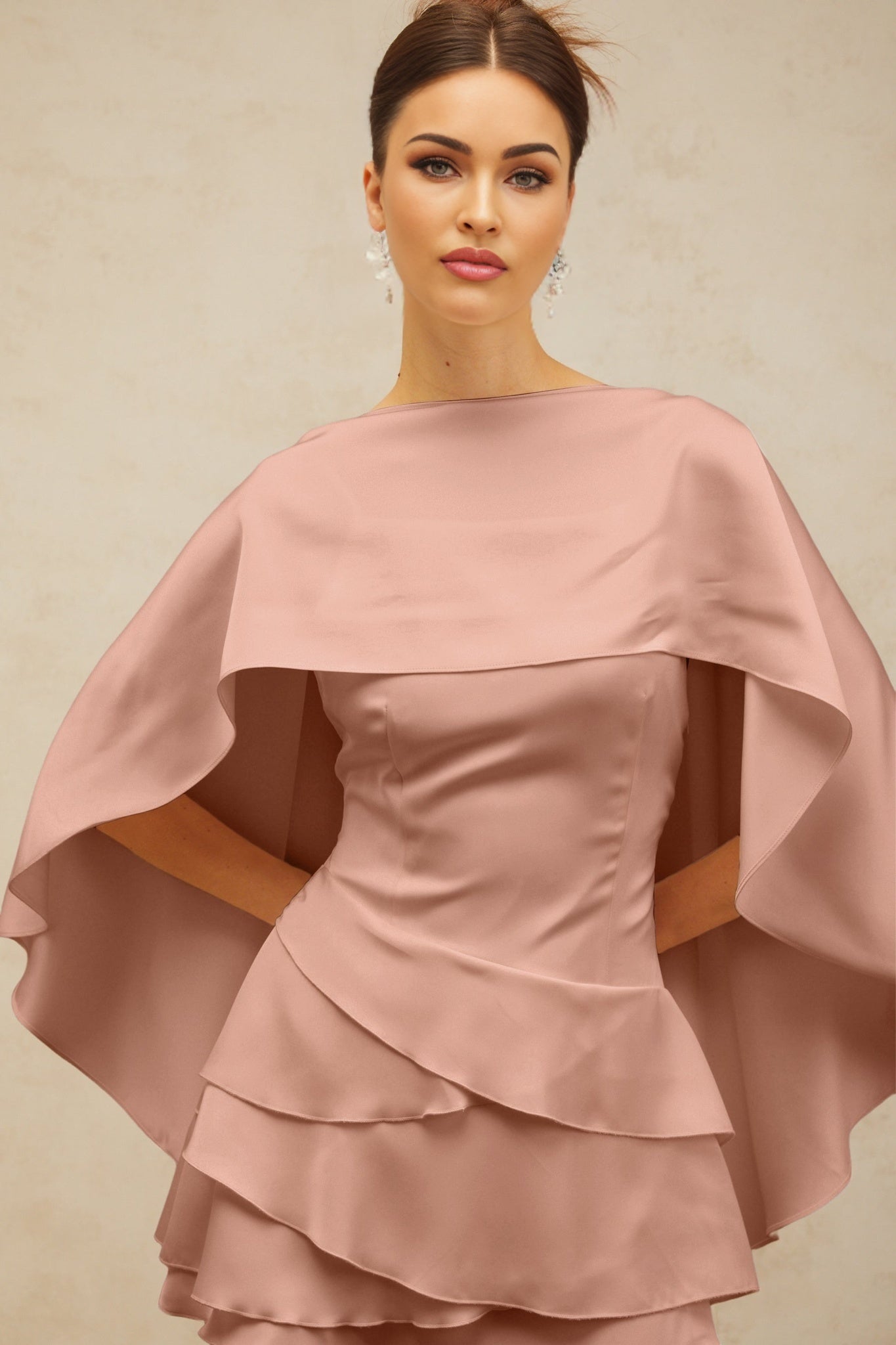 A pink satin mini dress with shawllike panel and ruffled details called Lyna