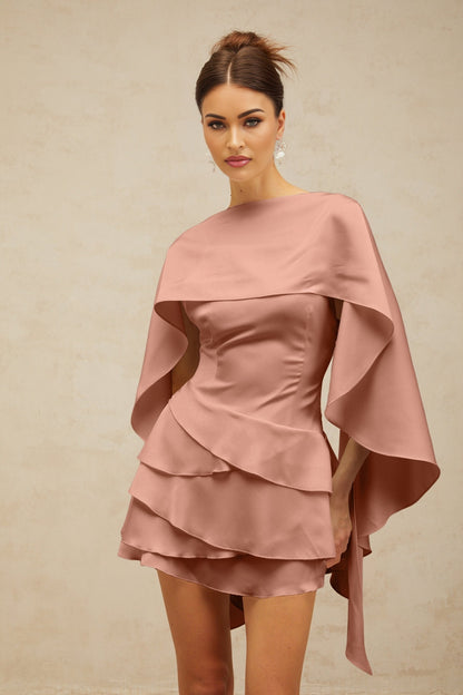 A pink satin mini dress with shawllike panel and ruffled details showcasing the Lyna design