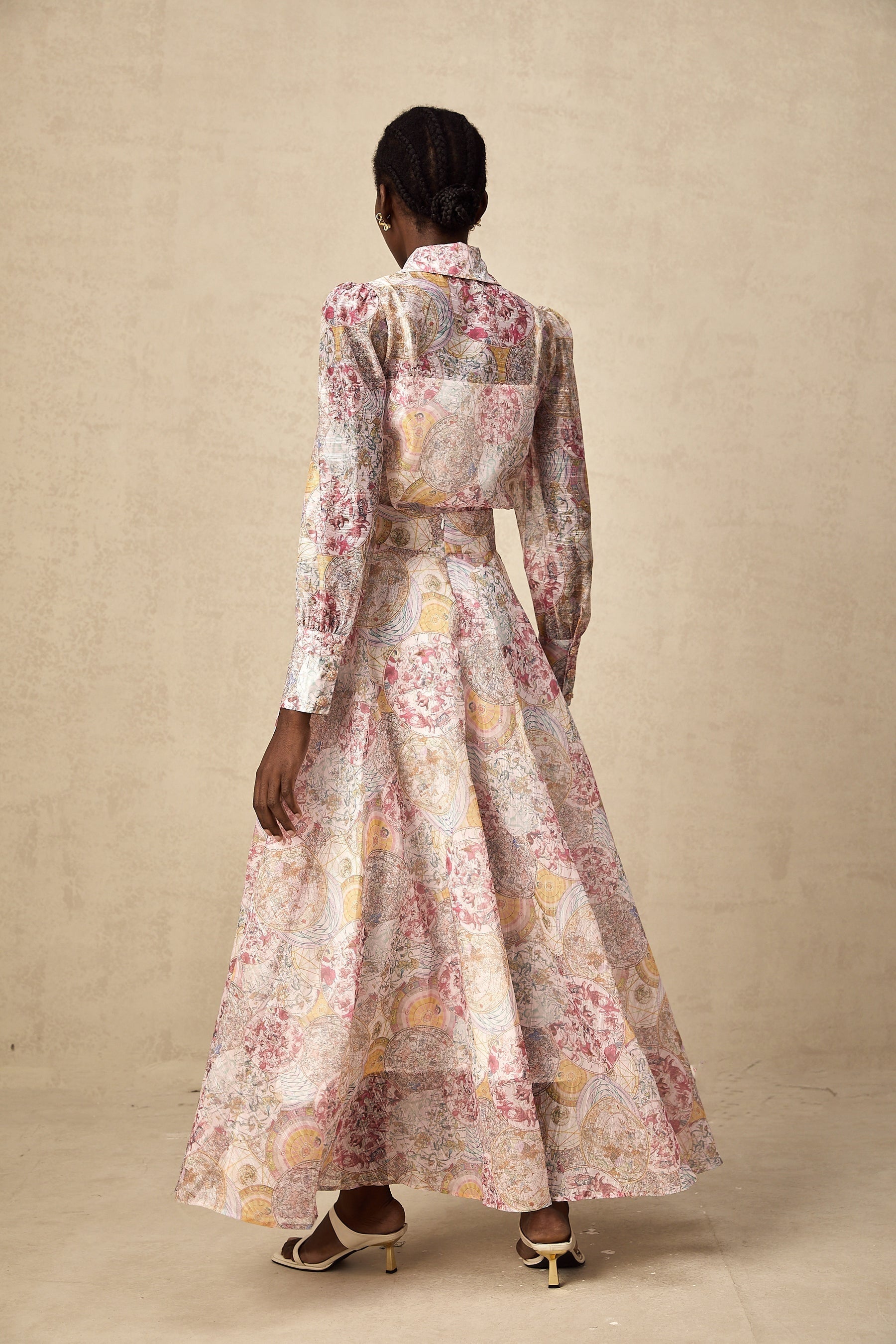 A pink shirt and skirt set with a cherry pattern print showcasing a matching outfit for women