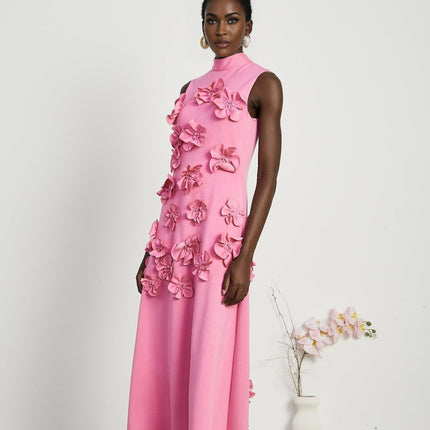 A pink sleeveless maxi dress with a bow and artificial flower decoration named Magali
