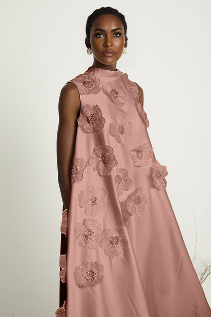 A pink sleeveless midi dress with floral applique details named Emilie
