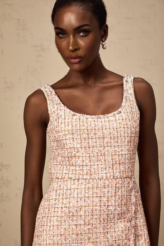 A pink tweed mini dress with embellishments named Aoife featuring a short hemline and decorative details